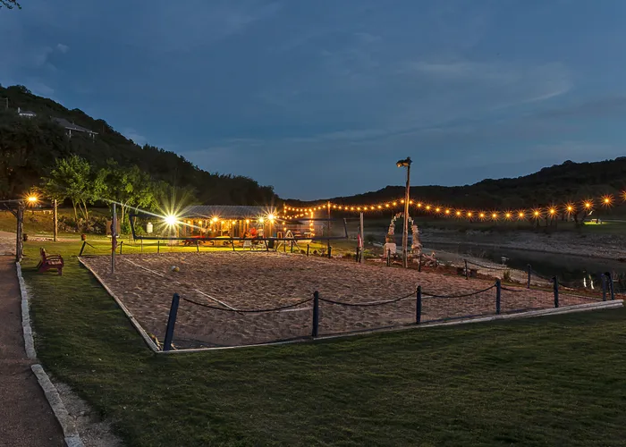 Sand volleyball court lit up at night